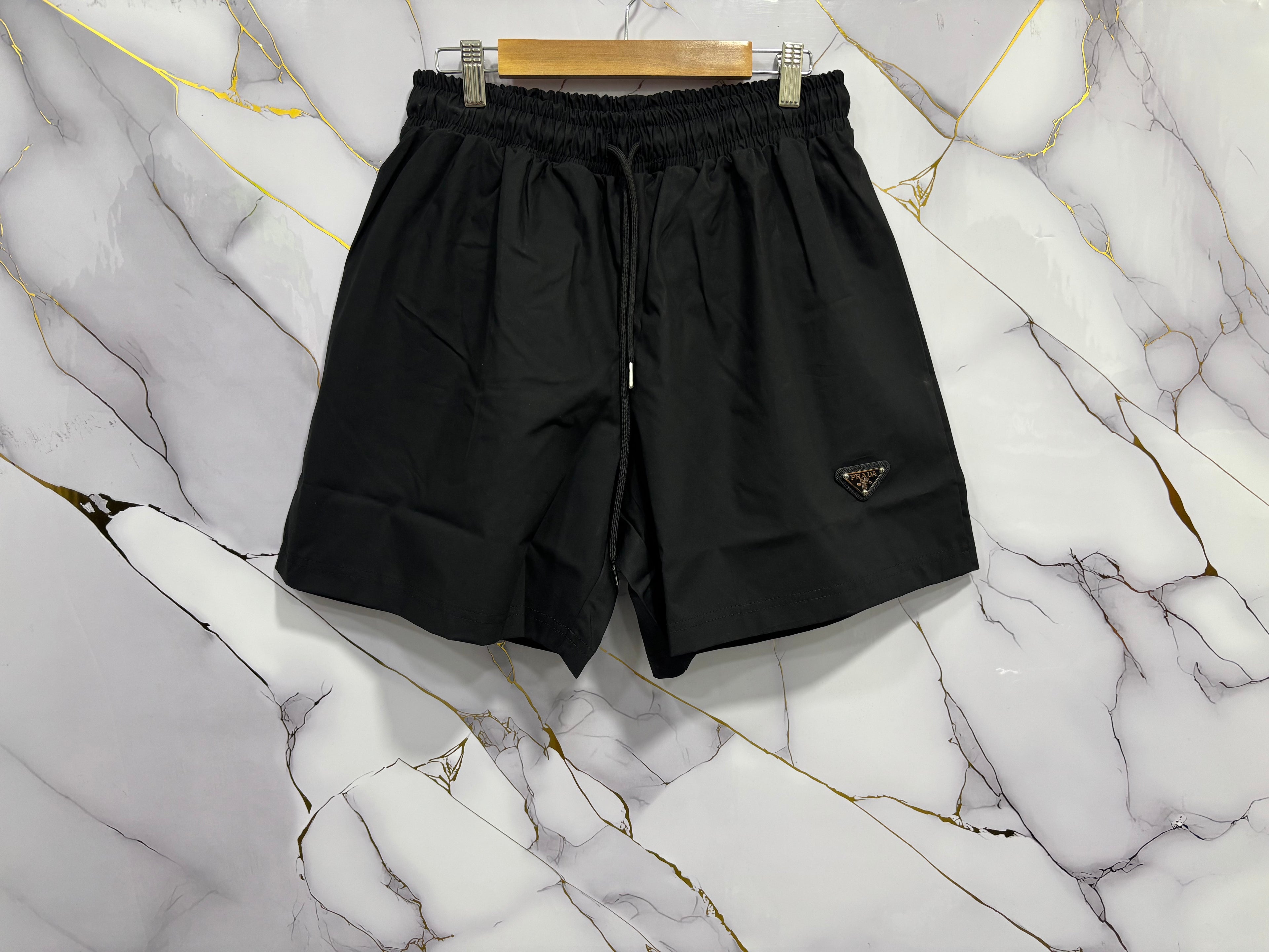 COSTUME PRADA PLACCA